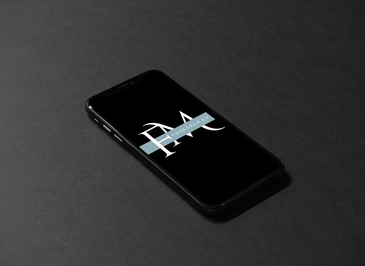 Phone showing the FM Search logo
